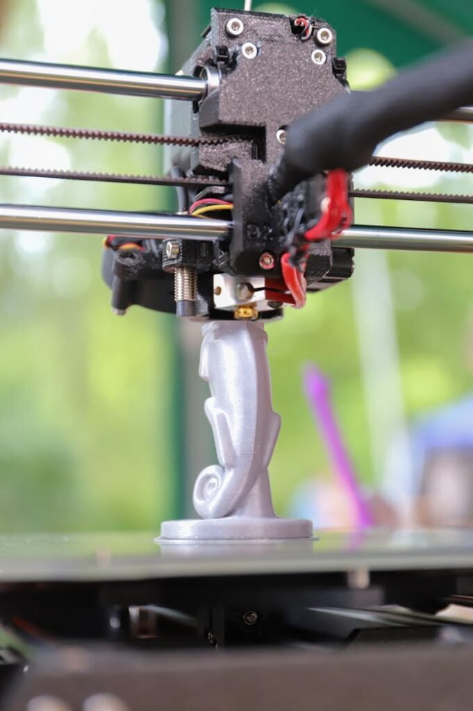 zipwp-image-13624760 Close-up of a 3D Printer Printing a White Figurine